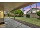 Enjoy the lush backyard view from the covered patio, perfect for outdoor entertaining at 664 E Windsor Dr, Gilbert, AZ 85296