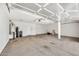 Spacious garage with water heater, storage, and concrete flooring at 664 E Windsor Dr, Gilbert, AZ 85296