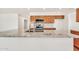 Kitchen island featuring granite countertops, stainless steel appliances, and natural wood cabinets at 664 E Windsor Dr, Gilbert, AZ 85296