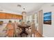 Charming breakfast nook featuring hardwood floors, a round table, and well-lit open space at 664 E Windsor Dr, Gilbert, AZ 85296