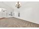 Bright living space boasts vaulted ceilings, multiple windows, and wood-look floors at 664 E Windsor Dr, Gilbert, AZ 85296