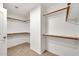 Spacious walk-in closet with custom shelving and racks offer ample storage space for clothing and accessories at 664 E Windsor Dr, Gilbert, AZ 85296