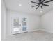 Bright bedroom with ceiling fan and doors opening to the backyard and pool at 676 W Shawnee Dr, Chandler, AZ 85225