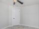 Bedroom featuring neutral walls, modern ceiling fan and lighting, and a single door at 676 W Shawnee Dr, Chandler, AZ 85225