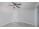 Minimalist bedroom featuring tiled floors, ceiling fan and a single door entrance at 676 W Shawnee Dr, Chandler, AZ 85225