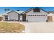 Charming single-story home featuring stucco siding, a two-car garage, and a well-maintained front yard at 676 W Shawnee Dr, Chandler, AZ 85225