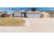 Charming single-story home featuring stucco siding, a two-car garage, and a well-maintained front yard at 676 W Shawnee Dr, Chandler, AZ 85225