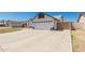 Spacious two-car garage with a large driveway and a gated side yard for added privacy at 676 W Shawnee Dr, Chandler, AZ 85225