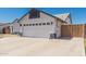 Well-maintained two-car garage with a large driveway, offering ample parking space and easy access at 676 W Shawnee Dr, Chandler, AZ 85225