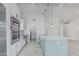 Bright kitchen features updated appliances, ample storage, and a center island with stylish countertops at 676 W Shawnee Dr, Chandler, AZ 85225