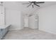 Bright living room featuring tile floors, a ceiling fan, and stylish lighting fixtures at 676 W Shawnee Dr, Chandler, AZ 85225