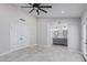 Spacious main bedroom featuring an ensuite bath with dual sink vanity and modern ceiling fan at 676 W Shawnee Dr, Chandler, AZ 85225