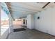 Relax in the shade of the covered patio featuring decorative lighting and ceiling fans at 676 W Shawnee Dr, Chandler, AZ 85225