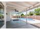 Enjoy the outdoors on this covered patio with a ceiling fan overlooking the pool at 676 W Shawnee Dr, Chandler, AZ 85225