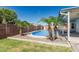Lounge by the pool surrounded by mature palm trees and desert landscaping at 676 W Shawnee Dr, Chandler, AZ 85225