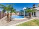 Enjoy the pool surrounded by desert landscaping and a covered patio at 676 W Shawnee Dr, Chandler, AZ 85225