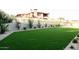 Sprawling green backyard featuring lush turf and decorative landscaping, perfect for recreation at 7215 N Black Rock Trl, Paradise Valley, AZ 85253