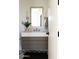 Stylish bathroom showcases vanity with marble countertop, modern mirror, and lighting at 7215 N Black Rock Trl, Paradise Valley, AZ 85253