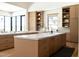 Bright kitchen featuring custom wood cabinets, marble countertops, and modern fixtures, showcasing high-end design at 7215 N Black Rock Trl, Paradise Valley, AZ 85253