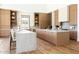 Spacious kitchen with hardwood floors, marble countertops, and custom wood cabinetry for a modern, luxurious feel at 7215 N Black Rock Trl, Paradise Valley, AZ 85253
