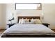 Relaxing bedroom featuring neutral bedding, sconce lighting, and bedside tables at 7215 N Black Rock Trl, Paradise Valley, AZ 85253