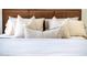 Close up of a bed dressed with decorative pillows and soft, neutral bedding at 7215 N Black Rock Trl, Paradise Valley, AZ 85253