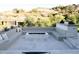 Inviting outdoor firepit area with built-in seating, perfect for entertaining and enjoying the outdoors at 7215 N Black Rock Trl, Paradise Valley, AZ 85253