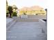 Stylish outdoor seating area with views of the surrounding landscape and comfortable neutral-colored pillows at 7215 N Black Rock Trl, Paradise Valley, AZ 85253