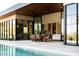 Outdoor patio area featuring dining area and seamless flow to the backyard pool and mountain views at 7215 N Black Rock Trl, Paradise Valley, AZ 85253