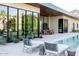 Resort-style backyard showcasing a pool, outdoor seating and patio, with a seamless blend of indoor and outdoor living at 7215 N Black Rock Trl, Paradise Valley, AZ 85253