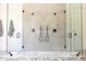 Detailed view of a luxurious glass enclosed shower with dual shower heads at 7215 N Black Rock Trl, Paradise Valley, AZ 85253