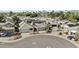 Aerial view of houses with solar panels and mountain views at 7536 W Sequoia Dr, Glendale, AZ 85308