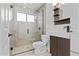 Bathroom features a tiled, glass-enclosed shower and modern vanity at 7536 W Sequoia Dr, Glendale, AZ 85308