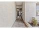 Covered entryway with decorative security gate, offering both protection and curb appeal at 7536 W Sequoia Dr, Glendale, AZ 85308