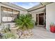 Inviting entryway featuring a garden, tiled walkway, and a double-door entrance at 7536 W Sequoia Dr, Glendale, AZ 85308