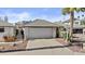 Well-maintained single-story home showcasing desert landscaping, a two-car garage, and a welcoming facade at 7536 W Sequoia Dr, Glendale, AZ 85308