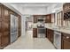 Well-equipped kitchen with granite countertops and stainless-steel appliances and ample cabinet space at 7536 W Sequoia Dr, Glendale, AZ 85308