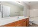 Bright bathroom featuring quartz countertop, wood cabinet, and bathtub at 7716 W Pueblo Ave, Phoenix, AZ 85043