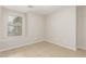 Bright, neutral bedroom features tile flooring, window, and a serene atmosphere for relaxation at 7716 W Pueblo Ave, Phoenix, AZ 85043