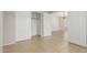 Bright bedroom features tile flooring, closet, and doorway to adjoining room at 7716 W Pueblo Ave, Phoenix, AZ 85043