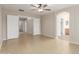 Spacious primary bedroom featuring neutral paint, tile flooring, and ceiling fan at 7716 W Pueblo Ave, Phoenix, AZ 85043