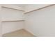 Walk-in closet featuring built-in shelves and wood racks at 7716 W Pueblo Ave, Phoenix, AZ 85043
