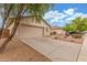 Charming single-story home with a two-car garage, desert landscaping, and a paved driveway on a sunny day at 7716 W Pueblo Ave, Phoenix, AZ 85043