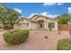 Inviting single-story home with a two-car garage and desert landscaping, situated on a well-maintained lot at 7716 W Pueblo Ave, Phoenix, AZ 85043