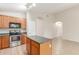 Spacious kitchen with an island offering a seamless flow to the living area at 7716 W Pueblo Ave, Phoenix, AZ 85043
