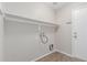 Spacious laundry room with overhead shelving at 7716 W Pueblo Ave, Phoenix, AZ 85043