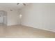 Open living room area offers tile flooring and view to adjacent room at 7716 W Pueblo Ave, Phoenix, AZ 85043