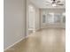 Main bedroom features tile flooring, ceiling fan, and access to ensuite bathroom at 7716 W Pueblo Ave, Phoenix, AZ 85043