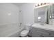 Clean bathroom features a shower-tub combo, sleek vanity with cabinet, and toilet with ample space at 7801 N 44Th Dr # 1003, Glendale, AZ 85301