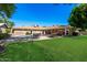 Expansive backyard with pool, patio, and lush green lawn at 7802 N 6Th St, Phoenix, AZ 85020